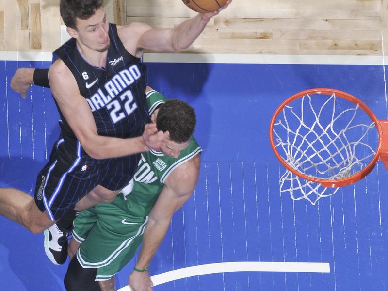 ORLANDO, FL - JANUARY 23: Franz Wagner #22 of the Orlando Magic drives to the basket during the game against the Boston Celtics on January 23, 2023 at Amway Center in Orlando, Florida. NOTE TO USER: User expressly acknowledges and agrees that, by downloading and or using this photograph, User is consenting to the terms and conditions of the Getty Images License Agreement. Mandatory Copyright Notice: Copyright 2023 NBAE (Photo by Fernando Medina/NBAE via Getty Images)