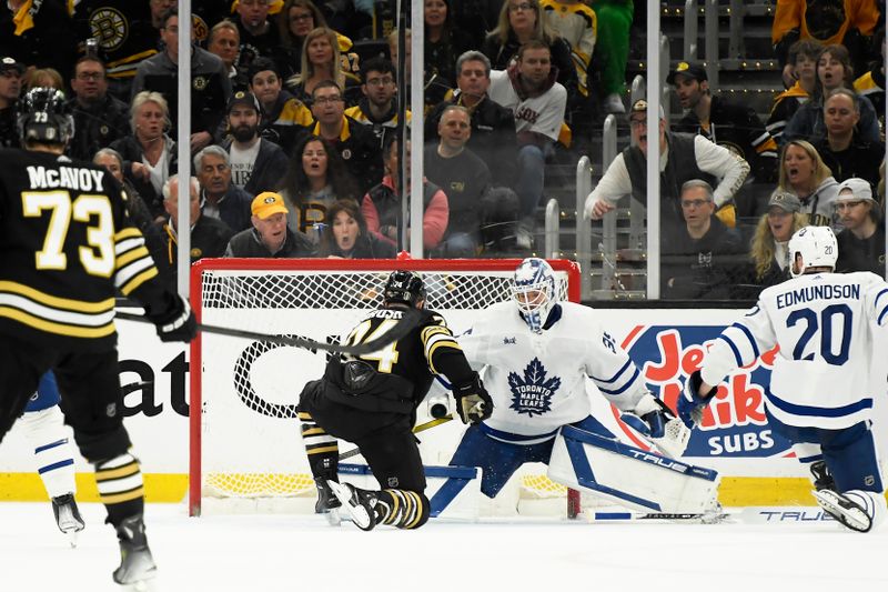 Apr 20, 2024; Boston, Massachusetts, USA; Boston Bruins left wing Jake DeBrusk (74) scores his second goal of the game past Toronto Maple Leafs goaltender Ilya Samsonov (35) during the second period in game one of the first round of the 2024 Stanley Cup Playoffs at TD Garden. Mandatory Credit: Bob DeChiara-USA TODAY Sports