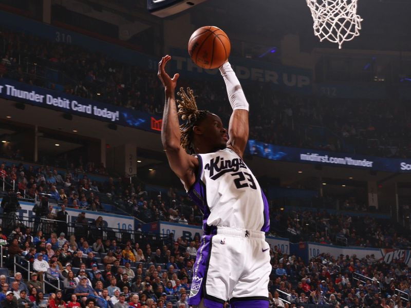 OKLAHOMA CITY, OK - FEBRUARY 11: Keon Ellis #23 of the Sacramento Kings grabs a rebound during the game against the Oklahoma City Thunder on February 11, 2024 at Paycom Arena in Oklahoma City, Oklahoma. NOTE TO USER: User expressly acknowledges and agrees that, by downloading and or using this photograph, User is consenting to the terms and conditions of the Getty Images License Agreement. Mandatory Copyright Notice: Copyright 2024 NBAE (Photo by Zach Beeker/NBAE via Getty Images)