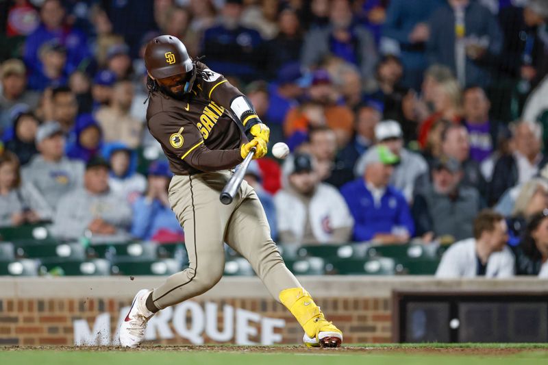 May 6, 2024; Chicago, Illinois, USA; San Diego Padres catcher Luis Campusano (12) hits a three-run double against the Chicago Cubs during the sixth inning at Wrigley Field. Mandatory Credit: Kamil Krzaczynski-USA TODAY Sports