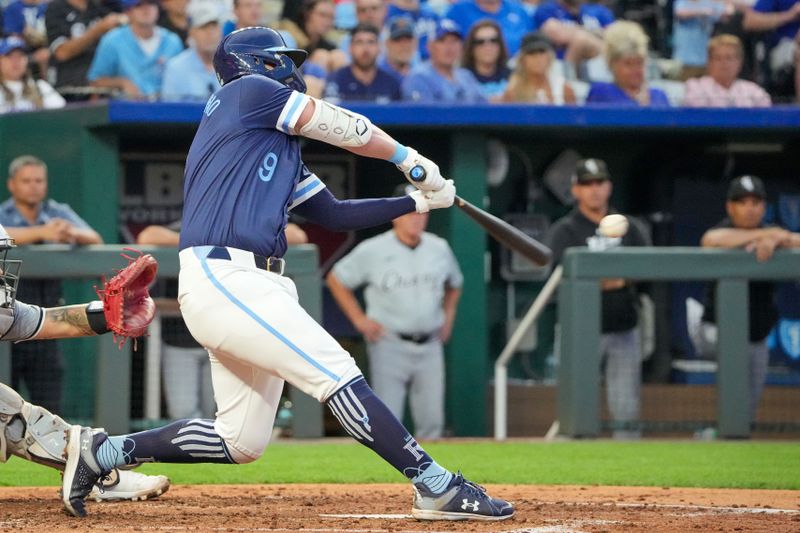 Jul 19, 2024; Kansas City, Missouri, USA; Kansas City Royals first base Vinnie Pasquantino (9) hits a one run sacrifice against the Chicago White Sox in the fifth inning at Kauffman Stadium. Mandatory Credit: Denny Medley-USA TODAY Sports