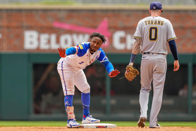 Jul 30, 2023; Cumberland, Georgia, USA; Atlanta Braves second baseman Ozzie Albies (1) reacts after hitting a double against the Milwaukee Brewers during the eighth inning at Truist Park. Mandatory Credit: Dale Zanine-USA TODAY Sports