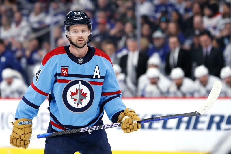 Jan 27, 2024; Winnipeg, Manitoba, CAN; Winnipeg Jets defenseman Josh Morrissey (44) waits for a face off in the second period against the Toronto Maple Leafs at Canada Life Centre. Mandatory Credit: James Carey Lauder-USA TODAY Sports