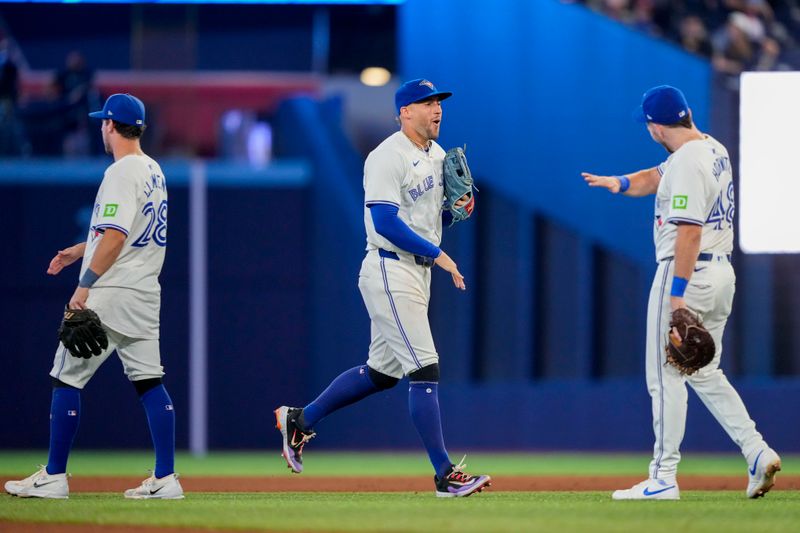 Jun 29, 2024; Toronto, Ontario, CAN; Toronto Blue Jays outfielder George Springer (4) celebrates with teammates after defeating the New York Yankees at Rogers Centre. Mandatory Credit: Kevin Sousa-USA TODAY Sports