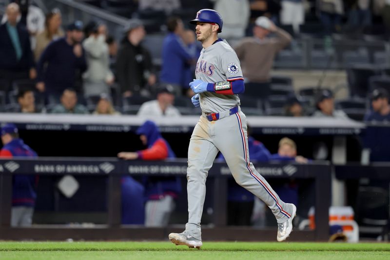 May 20, 2025; Bronx, New York, USA; Texas Rangers catcher Jonah Heim (28) rounds the bases after hitting a two run home run against the New York Yankees during the ninth inning at Yankee Stadium. Mandatory Credit: Brad Penner-Imagn Images