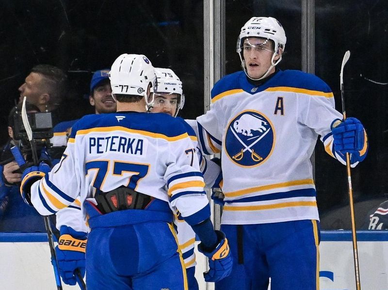 Nov 7, 2024; New York, New York, USA;  Buffalo Sabres right wing JJ Peterka (77) celebrates a goal by Buffalo Sabres center Tage Thompson (72) against the New York Rangers during the second period at Madison Square Garden. Mandatory Credit: Dennis Schneidler-Imagn Images