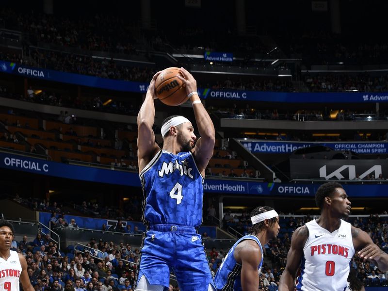 ORLANDO, FL - MARCH 3: Jalen Suggs #4 of the Orlando Magic goes up for the rebound during the game against the Detroit Pistons on March 3, 2024 at the Kia Center in Orlando, Florida. NOTE TO USER: User expressly acknowledges and agrees that, by downloading and or using this photograph, User is consenting to the terms and conditions of the Getty Images License Agreement. Mandatory Copyright Notice: Copyright 2024 NBAE (Photo by Fernando Medina/NBAE via Getty Images)