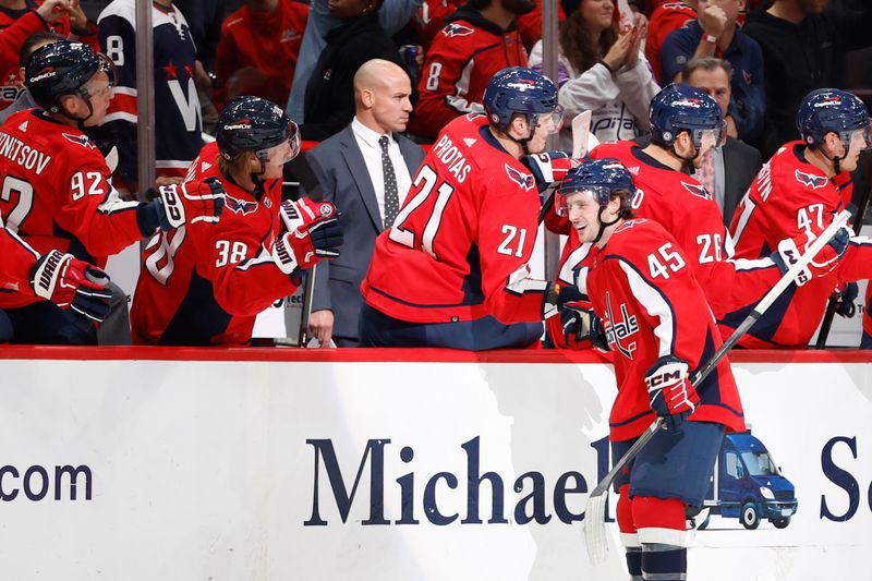 Oct 16, 2023; Washington, District of Columbia, USA; Washington Capitals center Matthew Phillips (45) celebrates with teammates after scoring a goal against the Calgary Flames in the second period at Capital One Arena. Mandatory Credit: Geoff Burke-USA TODAY Sports