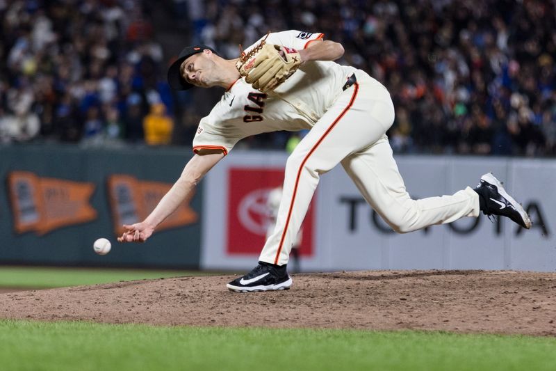 May 15, 2024; San Francisco, California, USA; San Francisco Giants pitcher Tyler Rogers (71) throws against the Los Angeles Dodgers during the eighth inning at Oracle Park. Mandatory Credit: John Hefti-USA TODAY Sports