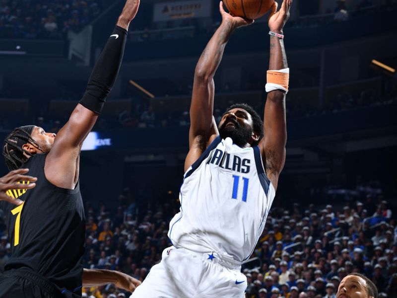 PHOENIX, AZ - NOVEMBER 12: Kyrie Irving #11 of the Dallas Mavericks shoots the ball during the game against the Golden State Warriors during the Emirates NBA Cup game on November 12, 2024 at Footprint Center in Phoenix, Arizona. NOTE TO USER: User expressly acknowledges and agrees that, by downloading and or using this photograph, user is consenting to the terms and conditions of the Getty Images License Agreement. Mandatory Copyright Notice: Copyright 2024 NBAE (Photo by Barry Gossage/NBAE via Getty Images)