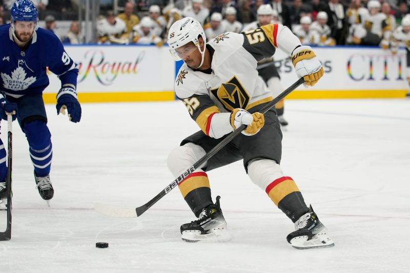 Nov 20, 2024; Toronto, Ontario, CAN; Vegas Golden Knights forward Keegan Kolesar (55) carries the puck against the Toronto Maple Leafs during the second period at Scotiabank Arena. Mandatory Credit: John E. Sokolowski-Imagn Images