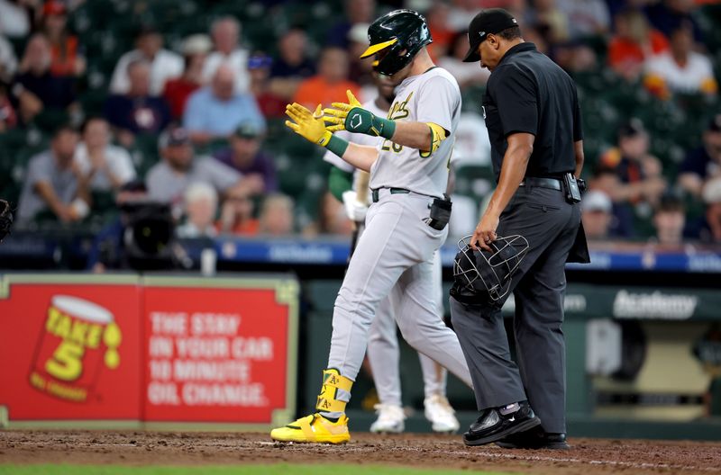 Sep 12, 2024; Houston, Texas, USA; Oakland Athletics first baseman Tyler Nevin (26) crosses home plate after hitting a home run against the Houston Astros during the ninth inning at Minute Maid Park. Mandatory Credit: Erik Williams-Imagn Images