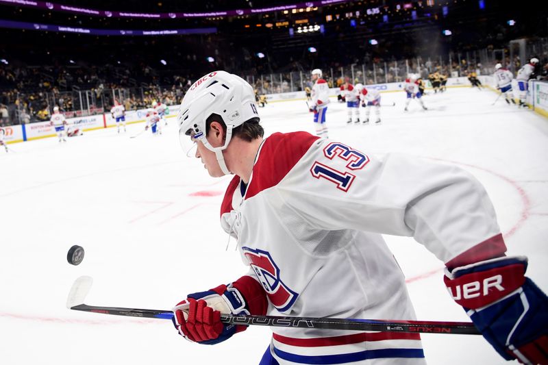 Oct 10, 2024; Boston, Massachusetts, USA;  Montreal Canadiens right wing Cole Caufield (13) bounces the puck off his stick during warmups prior to a game against the Boston Bruins at TD Garden. Mandatory Credit: Bob DeChiara-Imagn Images