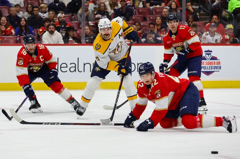 Nov 7, 2024; Sunrise, Florida, USA; Nashville Predators left wing Filip Forsberg (9) watches after passing the puck past Florida Panthers defenseman Gustav Forsling (42) during the first period at Amerant Bank Arena. Mandatory Credit: Sam Navarro-Imagn Images