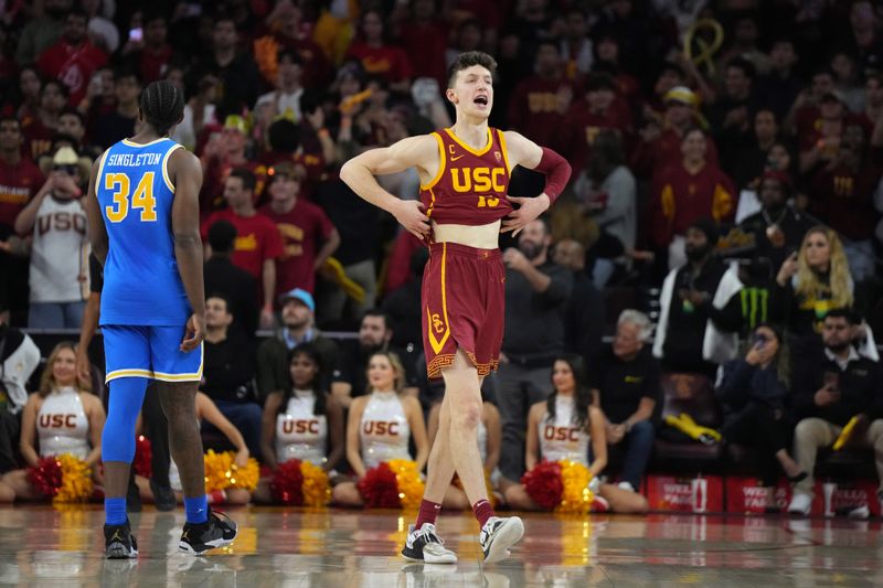 Jan 26, 2023; Los Angeles, California, USA; Southern California Trojans guard Drew Peterson (13) celebrates against the UCLA Bruins in the second half at Galen Center. Mandatory Credit: Kirby Lee-USA TODAY Sports