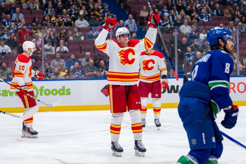 Oct 9, 2024; Vancouver, British Columbia, CAN; Calgary Flames forward Martin Pospisil (76) celebrates his goal against the Vancouver Canucks during the third period at Rogers Arena. Mandatory Credit: Bob Frid-Imagn Images