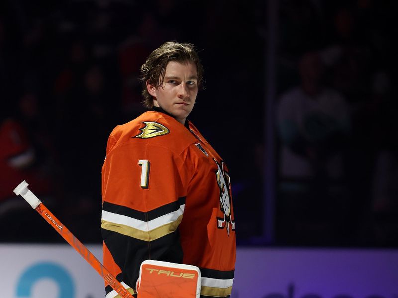 Dec 22, 2025; Anaheim, California, USA;  Anaheim Ducks goaltender Lukas Dostal (1) looks on during the national anthem prior to the game against the Seattle Kraken at Honda Center. Mandatory Credit: Kiyoshi Mio-Imagn Images