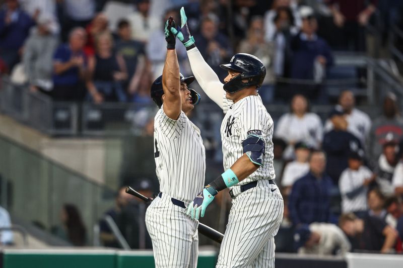 Aug 21, 2024; Bronx, New York, USA;  New York Yankees center fielder Aaron Judge (99) celebrates with designated hitter Giancarlo Stanton (27) after hitting a two run home run in the third inning against the Cleveland Guardians at Yankee Stadium. Mandatory Credit: Wendell Cruz-USA TODAY Sports