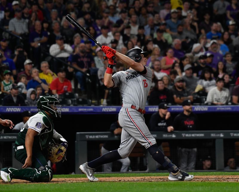 Sep 30, 2023; Denver, Colorado, USA; Minnesota Twins right fielder Max Kepler (26) hits a three run home run in the sixth inning against the Colorado Rockies at Coors Field. Mandatory Credit: John Leyba-USA TODAY Sports