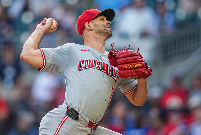 Sep 9, 2024; Cumberland, Georgia, USA; Cincinnati Reds starting pitcher Nick Martinez (28) pitches against the Atlanta Braves during the first inning at Truist Park. Mandatory Credit: Dale Zanine-Imagn Images