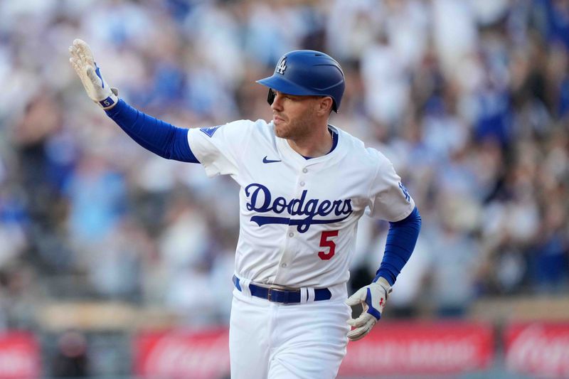 Jul 3, 2024; Los Angeles, California, USA; Los Angeles Dodgers first baseman Freddie Freeman (5) rounds the bases after hitting a three-run home run in the first inning against the Arizona Diamondbacks at Dodger Stadium. Mandatory Credit: Kirby Lee-USA TODAY Sports