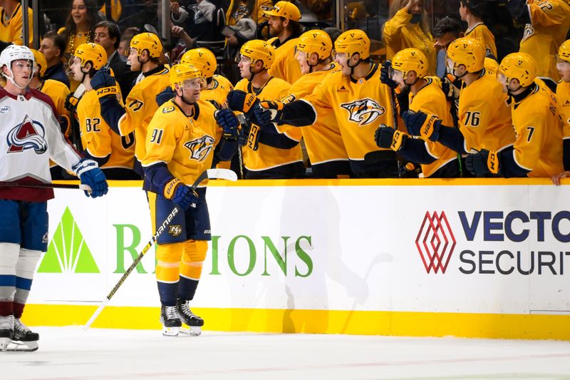 Nov 2, 2024; Nashville, Tennessee, USA;  Nashville Predators center Steven Stamkos (91) celebrates his goal with his teammates  against the Colorado Avalanche during the second period at Bridgestone Arena. Mandatory Credit: Steve Roberts-Imagn Images