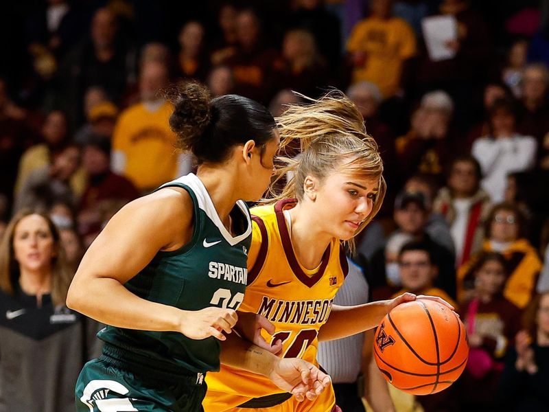 Jan 20, 2024; Minneapolis, Minnesota, USA; Minnesota Golden Gophers guard Mara Braun (10) works up court as Michigan State Spartans guard Moira Joiner (22) defends during the first half at Williams Arena. Mandatory Credit: Matt Krohn-USA TODAY Sports