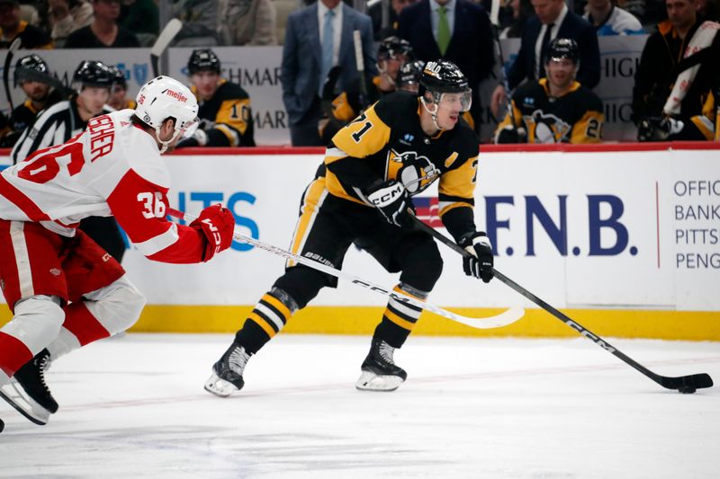 Mar 17, 2024; Pittsburgh, Pennsylvania, USA;  Pittsburgh Penguins center Evgeni Malkin (71) skates up ice with the puck as Detroit Red Wings right wing Christian Fischer (36) chases during the first period at PPG Paints Arena. Mandatory Credit: Charles LeClaire-USA TODAY Sports