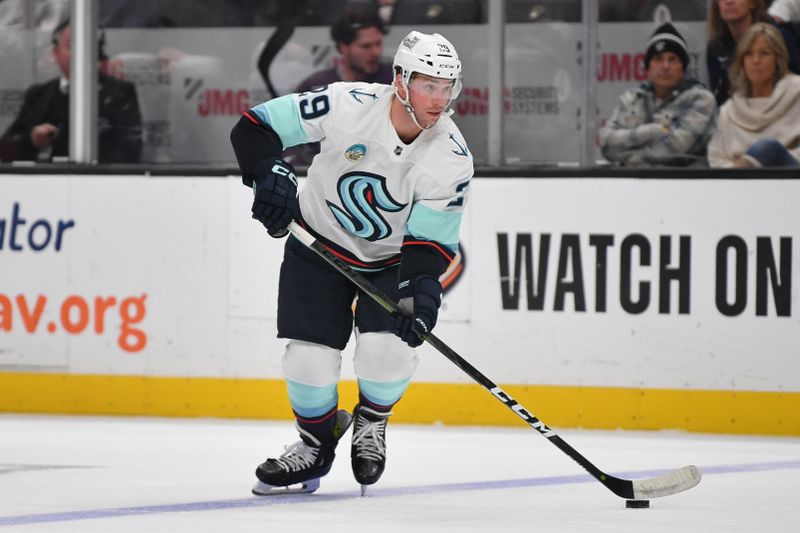 Dec 23, 2023; Anaheim, California, USA; Seattle Kraken defenseman Vince Dunn (29) controls the puck against the Anaheim Ducks during the first period at Honda Center. Mandatory Credit: Gary A. Vasquez-USA TODAY Sports