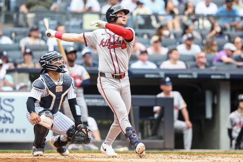 Jun 23, 2024; Bronx, New York, USA;  Atlanta Braves center fielder Jarred Kelenic (24) hits a solo home run in the third inning against the New York Yankees at Yankee Stadium. Mandatory Credit: Wendell Cruz-USA TODAY Sports