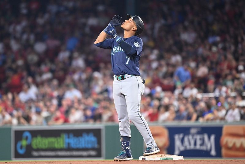 Jul 30, 2024; Boston, Massachusetts, USA; Seattle Mariners second baseman Jorge Polanco (7) reacts to hitting a double during the sixth inning against the Boston Red Sox at Fenway Park. Mandatory Credit: Eric Canha-USA TODAY Sports