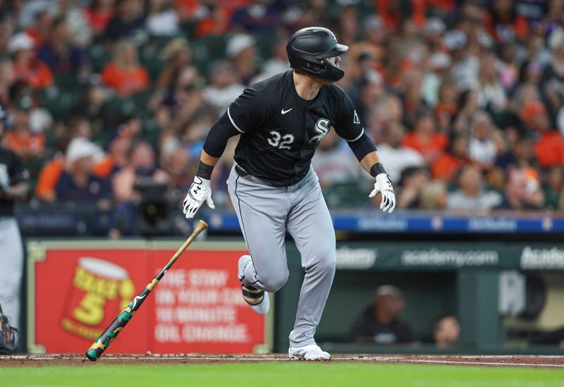 Aug 17, 2024; Houston, Texas, USA; Chicago White Sox designated hitter Gavin Sheets (32) hits an RBI single during the first inning against the Houston Astros at Minute Maid Park. Mandatory Credit: Troy Taormina-USA TODAY Sports