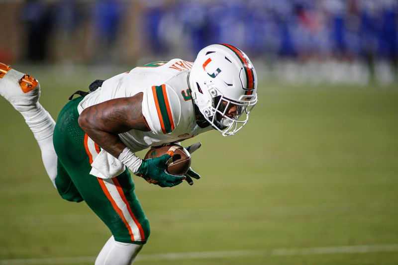 Dec 5, 2020; Durham, North Carolina, USA;  Miami Hurricanes tight end Brevin Jordan (9) dives across the goal line to score against the Duke Blue Devils in the first quarter at Wallace Wade Stadium. Mandatory Credit: Nell Redmond-USA TODAY Sports