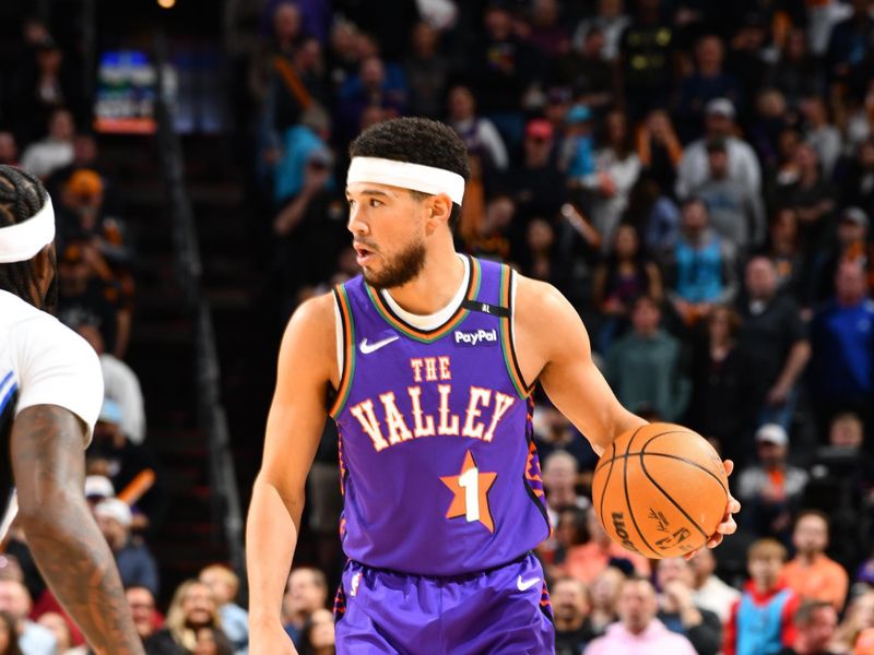 PHOENIX, AZ - NOVEMBER 18: Devin Booker #1 of the Phoenix Suns dribbles the ball during the game against the Orlando Magic on November 18, 2024 at Footprint Center in Phoenix, Arizona. NOTE TO USER: User expressly acknowledges and agrees that, by downloading and or using this photograph, user is consenting to the terms and conditions of the Getty Images License Agreement. Mandatory Copyright Notice: Copyright 2024 NBAE (Photo by Barry Gossage/NBAE via Getty Images)