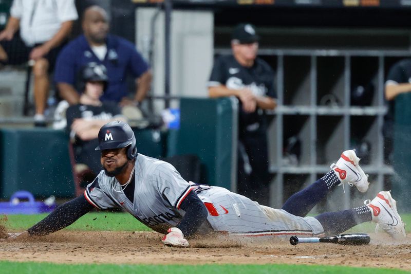 Jul 8, 2024; Chicago, Illinois, USA; Minnesota Twins outfielder Byron Buxton (25) scores against the Chicago White Sox during the 11th inning at Guaranteed Rate Field. Mandatory Credit: Kamil Krzaczynski-USA TODAY Sports