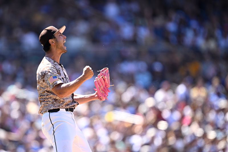 May 12, 2024; San Diego, California, USA; San Diego Padres starting pitcher Yu Darvish (11) celebrates after a strikeout to end the top of the sixth inning against the Los Angeles Dodgers at Petco Park. Mandatory Credit: Orlando Ramirez-USA TODAY Sports