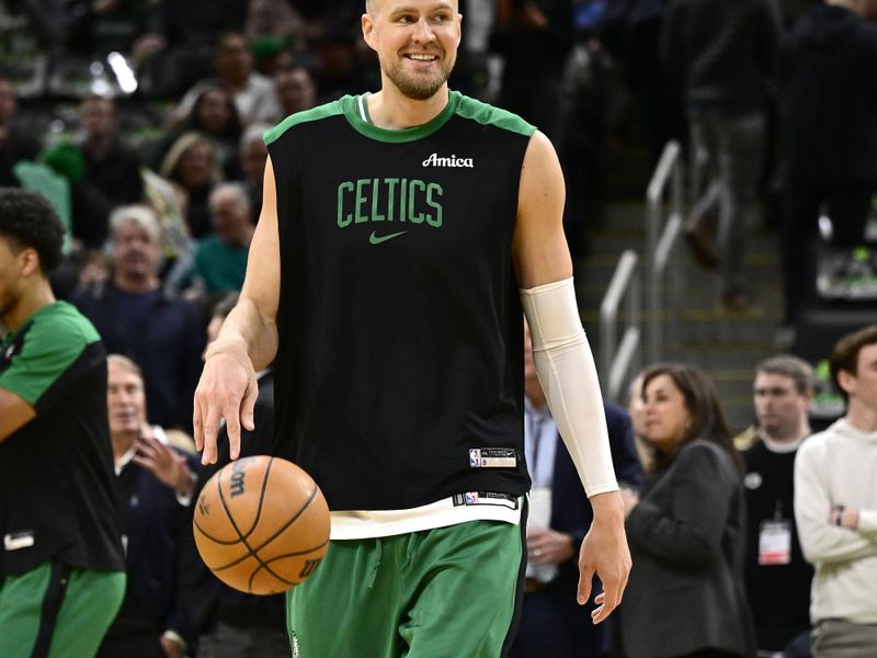 BOSTON, MASSACHUSETTS - JANUARY 10: Kristaps Porzingis #8 of the Boston Celtics warms up before a game against the Sacramento Kings at TD Garden on January 10, 2025 in Boston, Massachusetts.  NOTE TO USER: User expressly acknowledges and agrees that, by downloading and or using this photograph, User is consenting to the terms and conditions of the Getty Images License Agreement. (Photo by Billie Weiss/Getty Images)