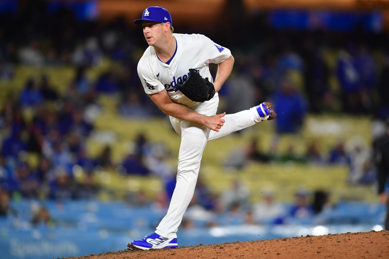 Apr 13, 2024; Los Angeles, California, USA; Los Angeles Dodgers pitcher Evan Phillips (59) throws against the San Diego Padres during the ninth inning at Dodger Stadium. Mandatory Credit: Gary A. Vasquez-USA TODAY Sports