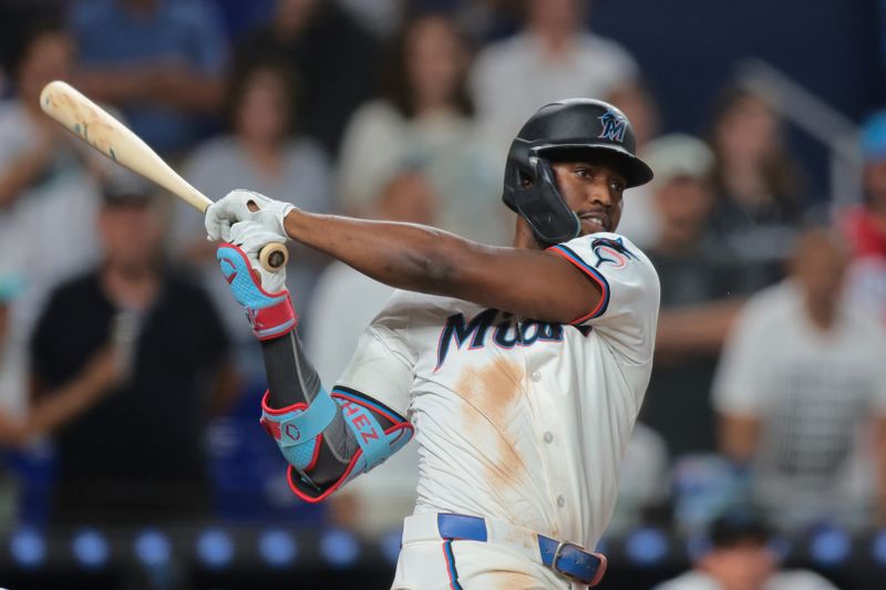 May 19, 2025; Miami, Florida, USA; Miami Marlins right fielder Jesus Sanchez (7) hits a two-run walk-off double against the Chicago Cubs during the ninth inning at loanDepot Park. Mandatory Credit: Sam Navarro-Imagn Images