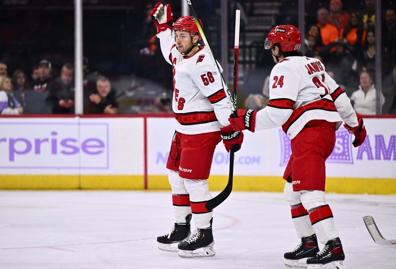 Nov 28, 2023; Philadelphia, Pennsylvania, USA; Carolina Hurricanes left wing Michael Bunting (58) celebrates after scoring a goal against the Philadelphia Flyers in the first period at Wells Fargo Center. Mandatory Credit: Kyle Ross-USA TODAY Sports