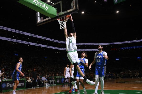 BOSTON, MA - DECEMBER 17: Kristaps Porzingis #8 of the Boston Celtics dunks the ball during the game against the Orlando Magic on December 17, 2023 at the TD Garden in Boston, Massachusetts. NOTE TO USER: User expressly acknowledges and agrees that, by downloading and or using this photograph, User is consenting to the terms and conditions of the Getty Images License Agreement. Mandatory Copyright Notice: Copyright 2023 NBAE  (Photo by Brian Babineau/NBAE via Getty Images)