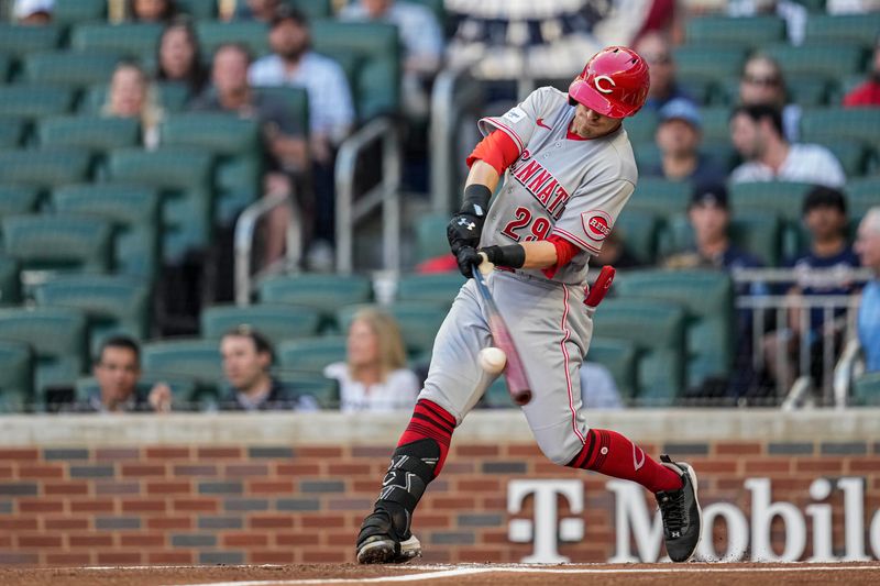 Apr 12, 2023; Cumberland, Georgia, USA; Cincinnati Reds center fielder TJ Friedl (29) singles against the Atlanta Braves during the first inning at Truist Park. Mandatory Credit: Dale Zanine-USA TODAY Sports