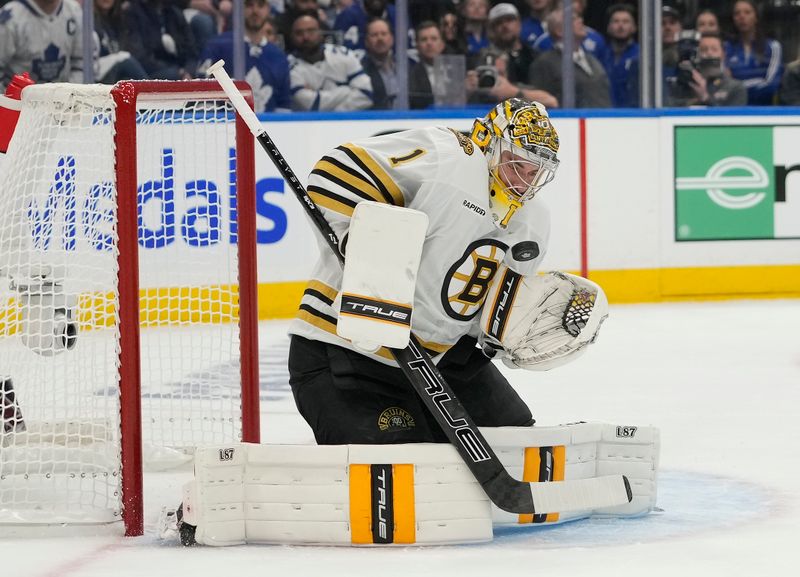 Apr 24, 2024; Toronto, Ontario, CAN; Boston Bruins goaltender Jeremy Swayman (1) makes a save against the Toronto Maple Leafs during the first period of game three of the first round of the 2024 Stanley Cup Playoffs at Scotiabank Arena. Mandatory Credit: John E. Sokolowski-USA TODAY Sports