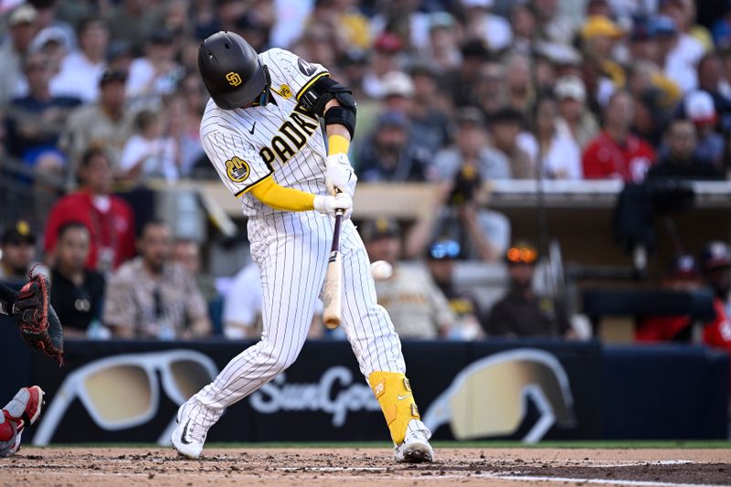 Jun 24, 2024; San Diego, California, USA; San Diego Padres catcher Kyle Higashioka (20) hits an two-RBI double during the second inning against the Washington Nationals at Petco Park. Mandatory Credit: Orlando Ramirez-USA TODAY Sports