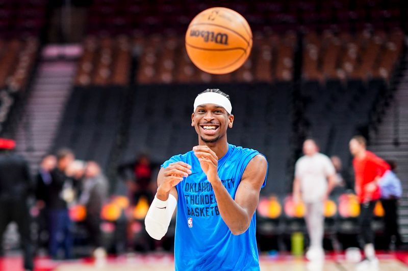 TORONTO, CANADA - MARCH 22:  Shai Gilgeous-Alexander #2 of the Oklahoma City Thunder smiles as he warms up before the game against the Toronto Raptors on March 22, 2024 at the Scotiabank Arena in Toronto, Ontario, Canada.  NOTE TO USER: User expressly acknowledges and agrees that, by downloading and or using this Photograph, user is consenting to the terms and conditions of the Getty Images License Agreement.  Mandatory Copyright Notice: Copyright 2024 NBAE (Photo by Mark Blinch/NBAE via Getty Images)