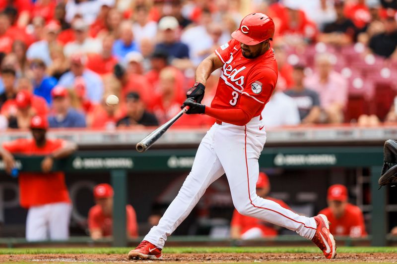 Jun 8, 2024; Cincinnati, Ohio, USA; Cincinnati Reds third baseman Jeimer Candelario (3) hits a solo home run in the first inning against the Chicago Cubs at Great American Ball Park. Mandatory Credit: Katie Stratman-USA TODAY Sports