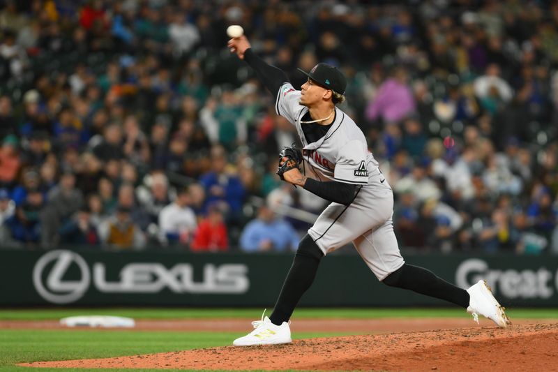 Apr 26, 2024; Seattle, Washington, USA; Arizona Diamondbacks relief pitcher Justin Martinez (63) pitches to the Seattle Mariners during the seventh inning at T-Mobile Park. Mandatory Credit: Steven Bisig-USA TODAY Sports