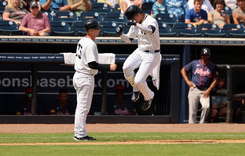 Mar 10, 2024; Tampa, Florida, USA;  New York Yankees left fielder Juan Soto (22) is congratulated after he hit a 3-run home run during the fourth inning  against the Atlanta Braves at George M. Steinbrenner Field. Mandatory Credit: Kim Klement Neitzel-USA TODAY Sports