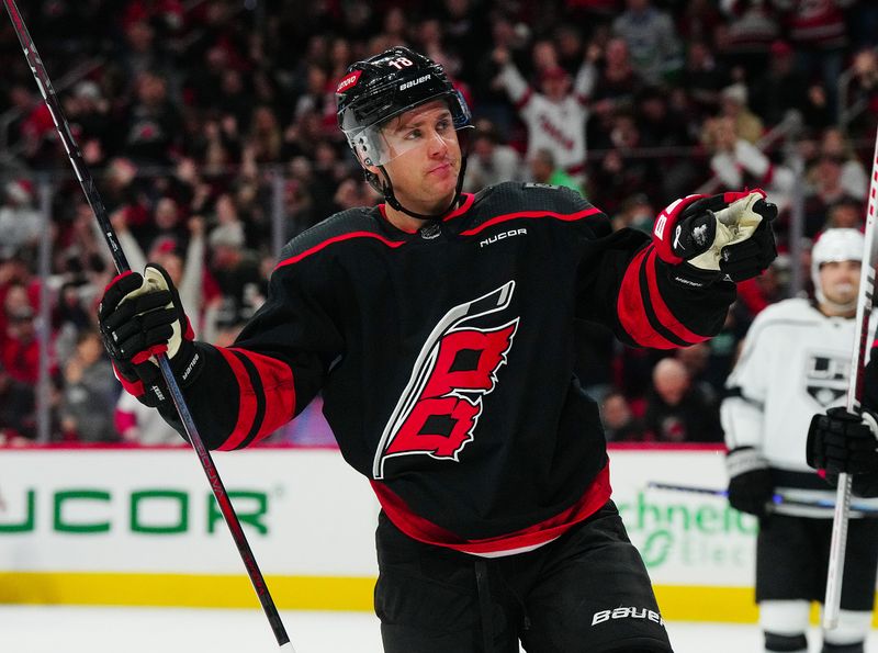 Jan 15, 2024; Raleigh, North Carolina, USA; Carolina Hurricanes center Jack Drury (18) celebrates his goal against the Los Angeles Kings during the third period at PNC Arena. Mandatory Credit: James Guillory-USA TODAY Sports