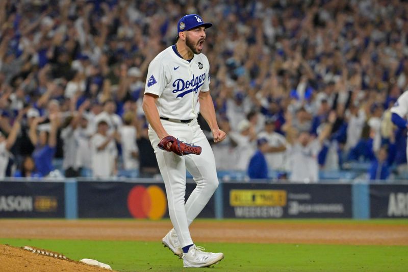 Oct 26, 2024; Los Angeles, California, USA; Los Angeles Dodgers pitcher Alex Vesia (51) reacts in the ninth inning against the New York Yankees during game two of the 2024 MLB World Series at Dodger Stadium. Mandatory Credit: Jayne Kamin-Oncea-Imagn Images